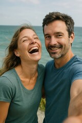 Fototapeta premium Smiling caucasian couple enjoying beach day