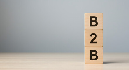 Wooden blocks stacked vertically, displaying the letters B2B, suggesting a business-to-business concept.