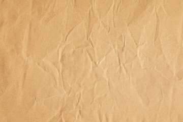 Crumpled yellow craft paper texture