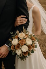 Bride and groom embrace autumn wedding bouquet outdoors