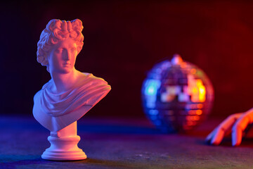 Classical Sculpture Bust Cradled in Mannequin Hand Neon Disco Ball
