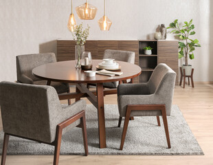 Scandinavian-inspired round dining table in walnut wood finish with four grey upholstered...