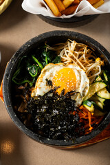 Asian bowl with fried egg