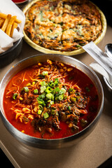 Asian curry bowl with noodles 