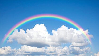 Rainbow arching over fluffy clouds