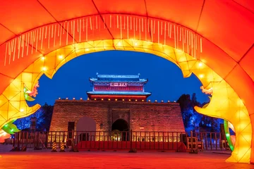 Fotobehang Rood Shanhaiguan Great Wall at night， The word in the photo translates as "Shanhaiguan"  © zhengzaishanchu