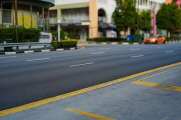 Obraz premium The image shows an empty street and crosswalk in an urban area