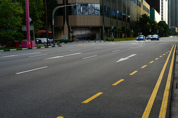The image shows an empty street and crosswalk in an urban area