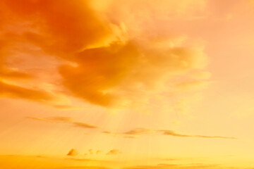 Orange sky with clouds during hot summer weather