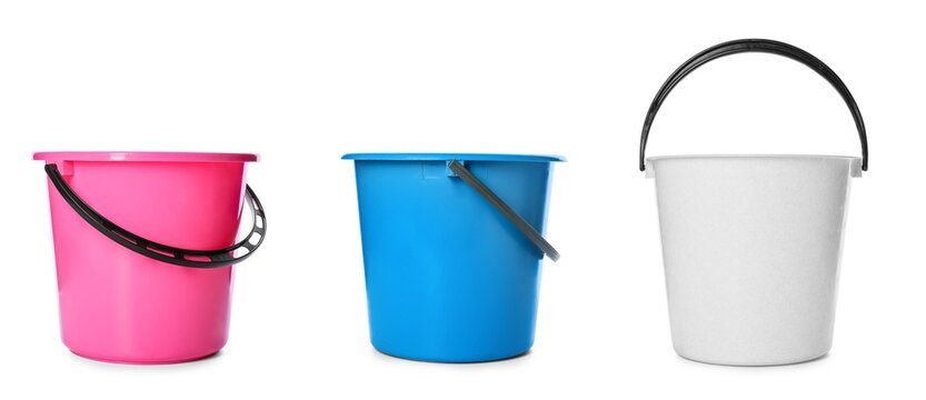 Set of plastic buckets on white background