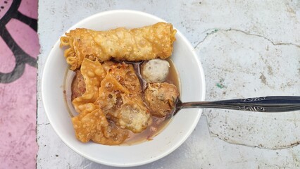 Bakso Malang is a meatball dish typical of Malang, East Java, which is famous for its abundant variety of fillings and savory, fatty broth, usually served with smooth meatballs, tendon meatballs etc