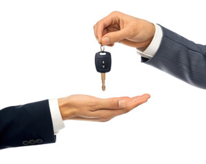 Two hands, giving and taking a car key, isolated on a transparent background