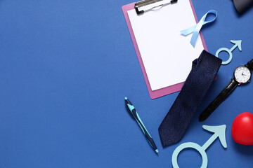 Male sign with clipboard, ribbon and male accessories on blue background. Prostate cancer awareness...