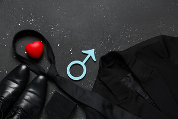 Male sign with heart and male clothes on black grunge background. Prostate cancer awareness concept