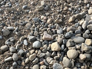 Gravel Rock Road Stretching Through Countryside Landscape