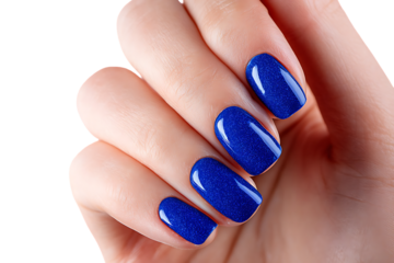 Close up of female hand with stylish blue nail polish.