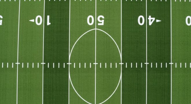 An Overhead View of an American Football Field Showing Yard Markers and the Center Circle