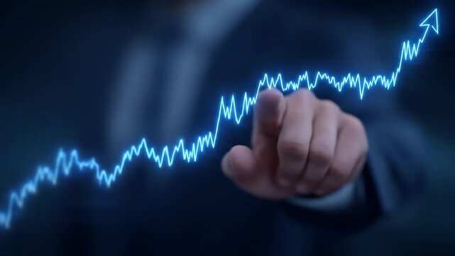 Glowing Blue Stock Market Chart Touched by Finger Shows Upward Trend in Dark Room With Suit Jacket Sleeve