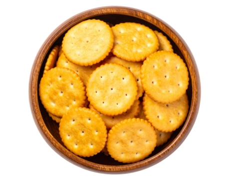  Top view of round golden crackers in rustic wooden bowl, isolated on white background PNG