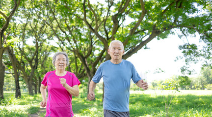 Happy Asian Senior couple running outdoor