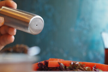 Perfectly seasoned fresh salad at a dining table