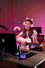 Young Asian Adult Streamer Woman Plays Acoustic Guitar Live Home Studio Music Performance Content