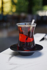 Turkish tea served in traditional glass in a cafe