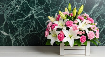 Beautiful lilies and carnations in a wooden box on a table for floral arrangement ideas