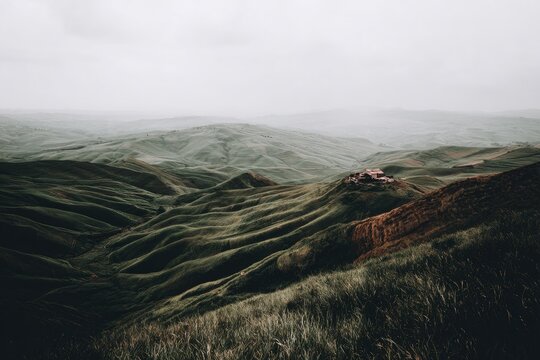 Misty mountain range, rolling hills