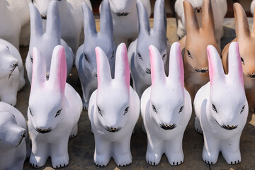 Rows of many rabbit models handicrafts for decoration made in countryside of Karnataka, India.
