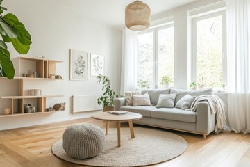 Clean and airy Scandinavian living room with light wood furniture and a gray sofa