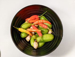  Red Chilies and Garlic on Wooden Board with Dark Background