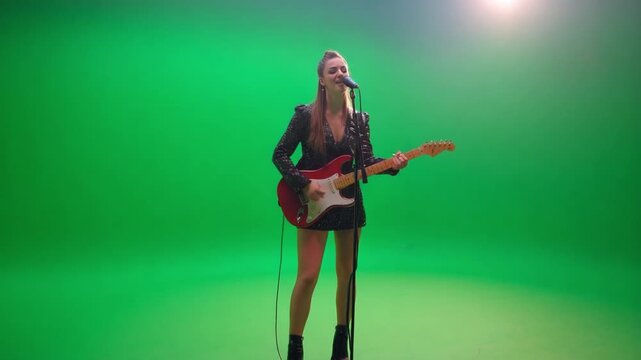 Electric Harmony: A vibrant portrayal of a female guitarist singing with passion and skill, illuminated by a bright spotlight in a studio.