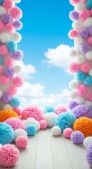 Playful arrangement of colorful pom-poms framing a bright blue sky with fluffy white clouds, creating a whimsical and cheerful scene.