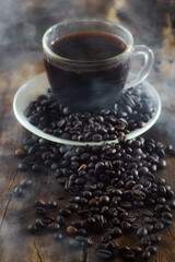 Cup of coffee on wooden table with copy space background, Half cup of coffee, Still life and sketch in dark tones, Top view for advertising, Business and Drink Concept