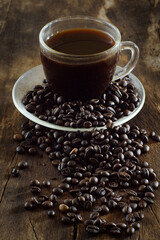Cup of coffee on wooden table with copy space background, Half cup of coffee, Still life and sketch in dark tones, Top view for advertising, Business and Drink Concept