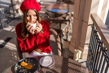 Woman Coffee Cafe: Lady drinks cappuccino at cafe outdoor in sunny day, enjoying dessert.