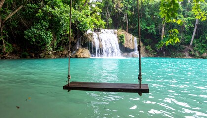 Wooden swing over a turquoise waterfall