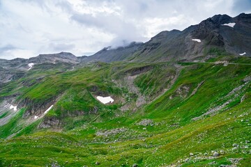 Experience breathtaking alpine views near Zell-am-See, Kaprun, Austria. Lush green mountains, serene lakes, and stunning glaciers create a perfect backdrop for outdoor adventures and relaxation.