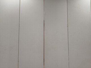 Background of multiple white folding doors