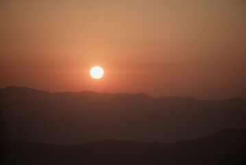 Sunrise on the top of a high mountain.