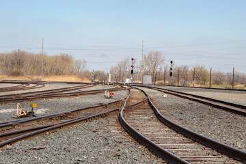 View of multiple rail tracks and signals. Railroad transportation.