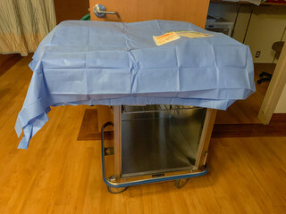 Instruments and tools covered up and ready for delivery of baby in maternity ward.