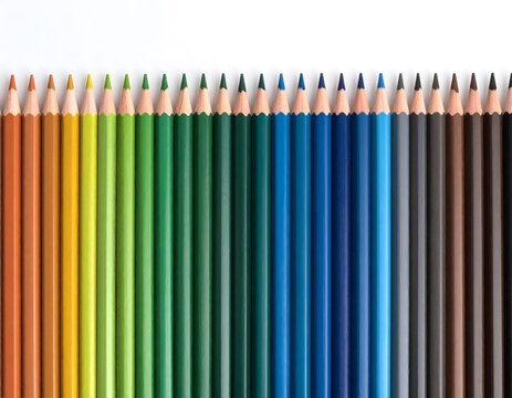 Colorful colored pencils arranged in a spectrum of hues, showcasing a variety of vibrant shades.
