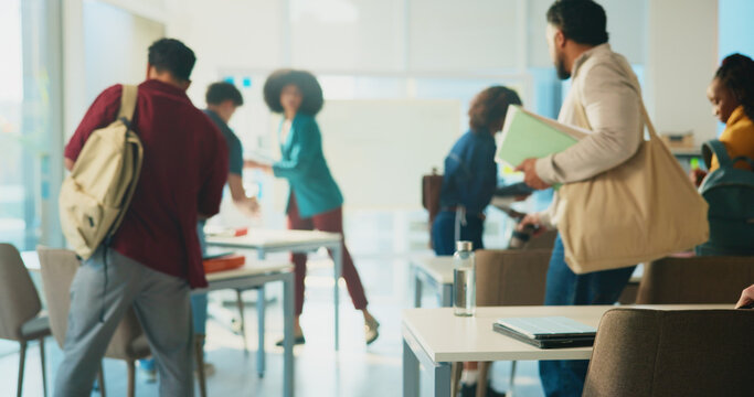Education, start lecture and students in classroom for studying, development or knowledge in college. University, learning and group begin lesson with arrival of people at campus with back view