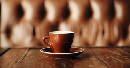 Caffeine, cup and wooden table in coffee shop booth for fresh beverage hospitality or service....