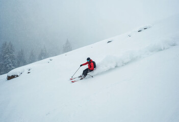 Skier Caught in Sudden Snowfall on Steep Hill