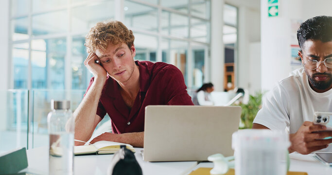 Student, laptop and bored with learning at university for test study, sleepy or education fatigue. College, man and low energy on campus with assignment burnout, thesis research and difficult course