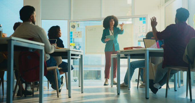 University, questions and education with students, woman and feedback with conversation. People, answer and teacher with discussion, college and learning with knowledge, exam schedule and development