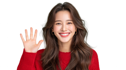 A woman with long brown hair is smiling and waving at the camera